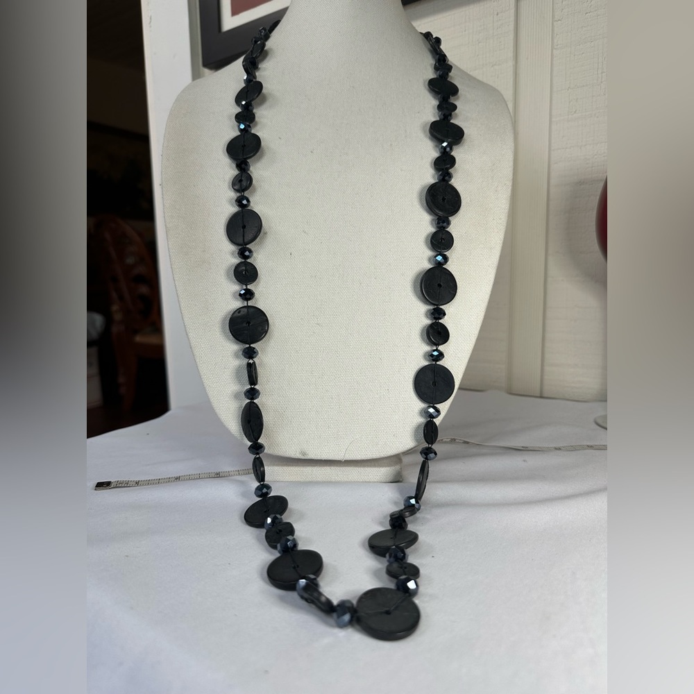 Long black disc necklace with sparkly blue beads